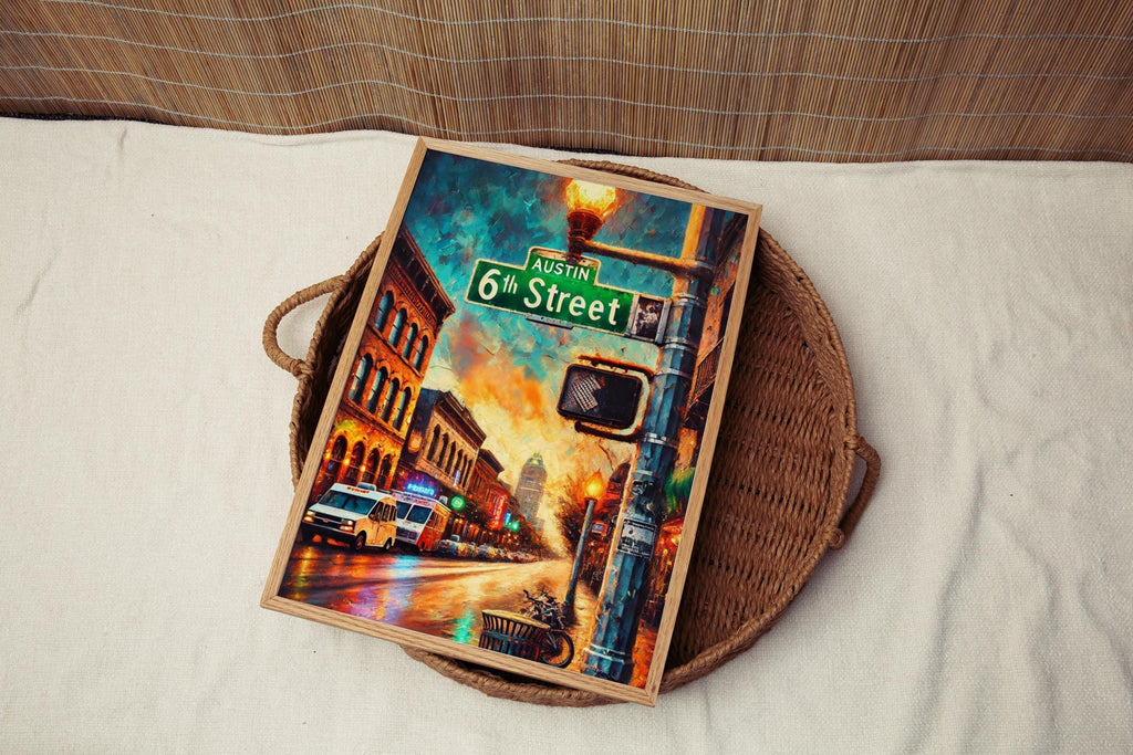 A framed 6th Street Wall Art Austin Print featuring a vibrant cityscape rests on a woven tray atop cream fabric—a colorful Texas City Travel Poster and perfect personalized gift or home decor.