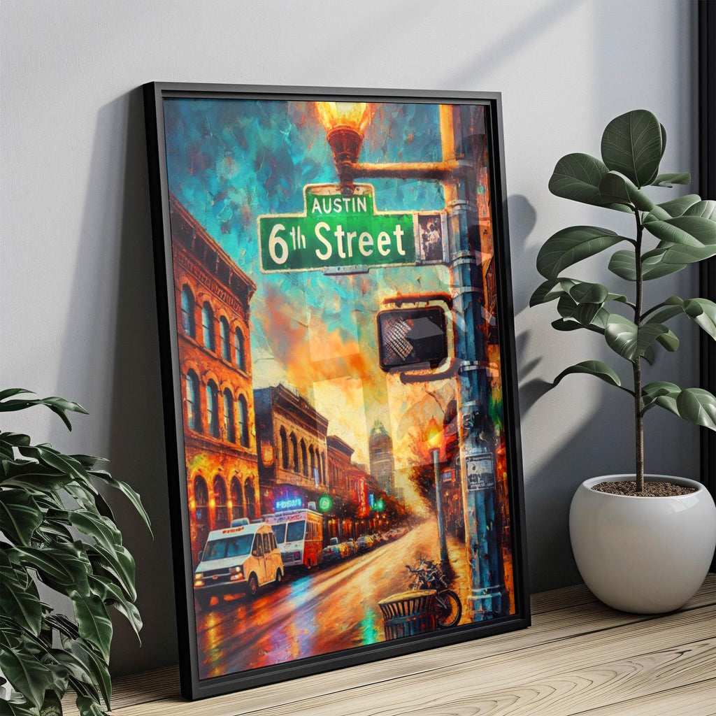 The 6th Street Wall Art Austin Print Texas City Travel Poster rests against a wall, displaying city lights, historic buildings, a street sign, and a glowing lamp; two potted plants are nearby on the wooden floor.