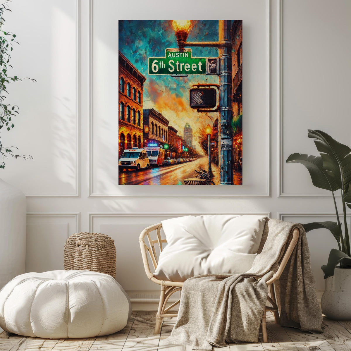 A cozy, modern living room with white walls, a soft pouf, rattan chair, blanket, and the 6th Street Wall Art Austin Print Texas City Travel Poster displayed above, adding vibrant city style as personalized home decor.